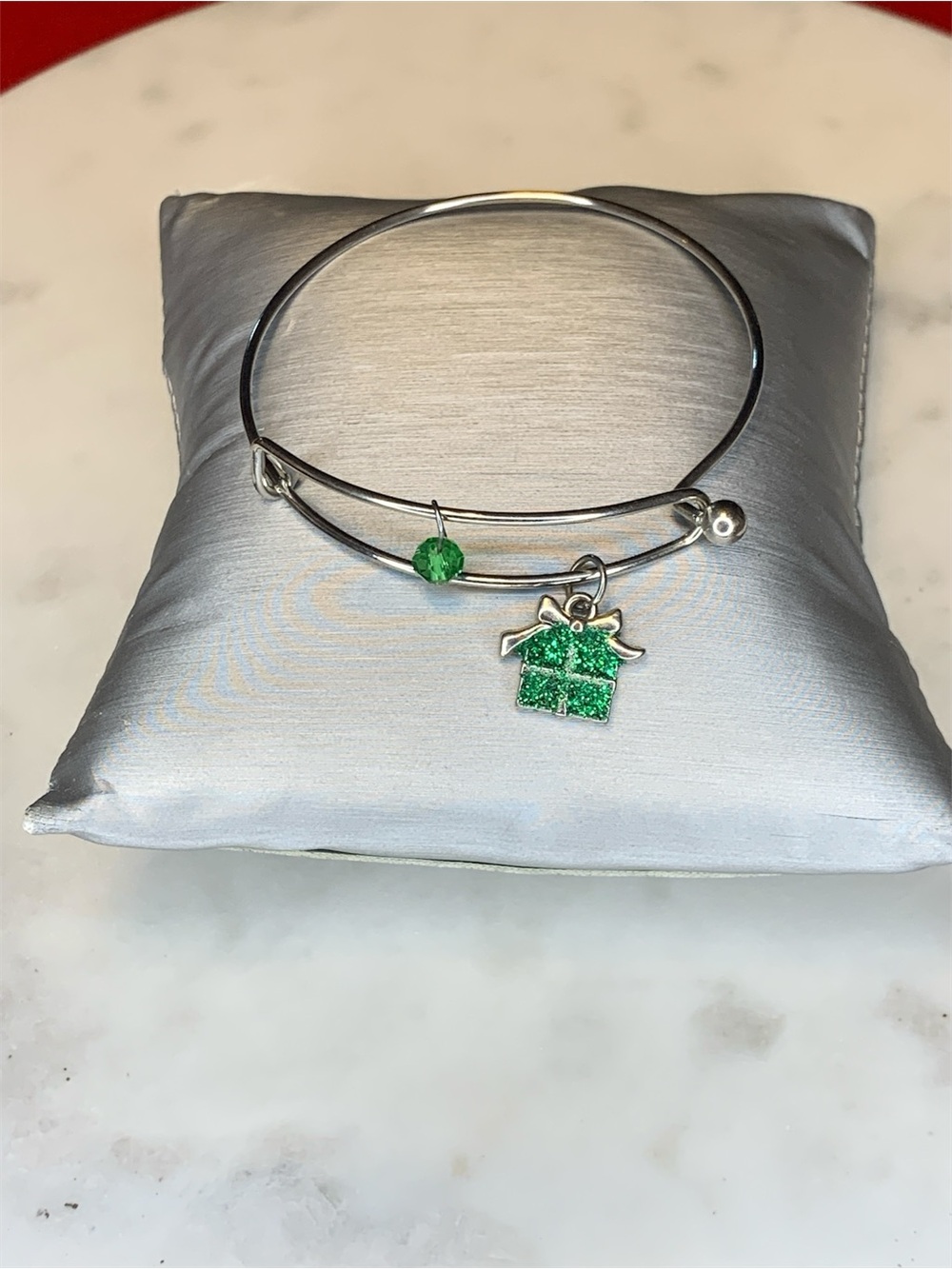 Silver-Tone Bangle Bracelet with Green Gift Charm